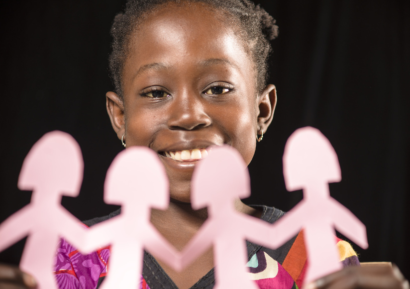image of black girl with paper chain of dolls